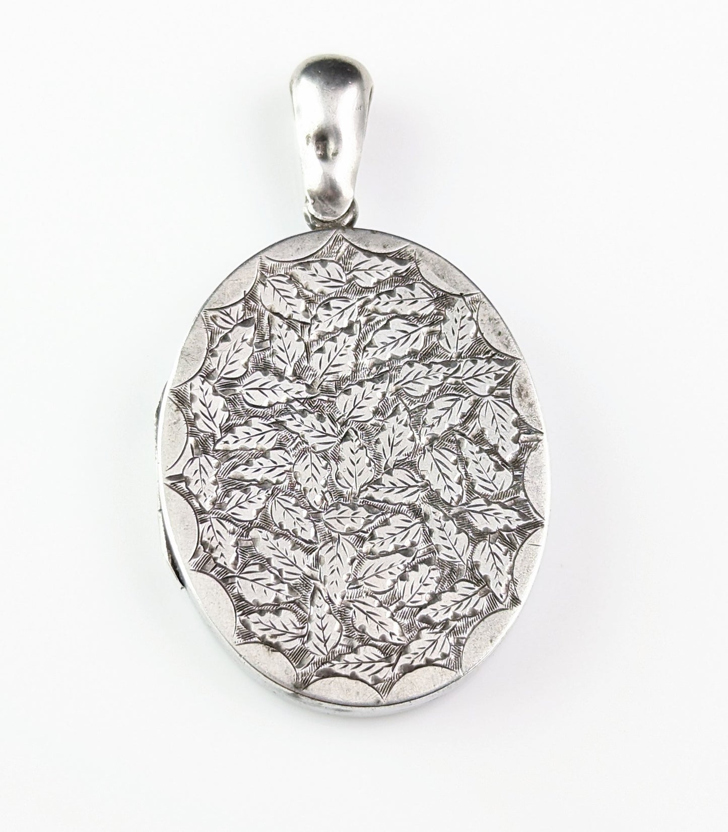 Antique Victorian sterling silver locket, leaf engraved