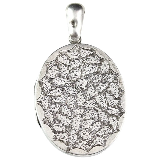 Antique Victorian sterling silver locket, leaf engraved