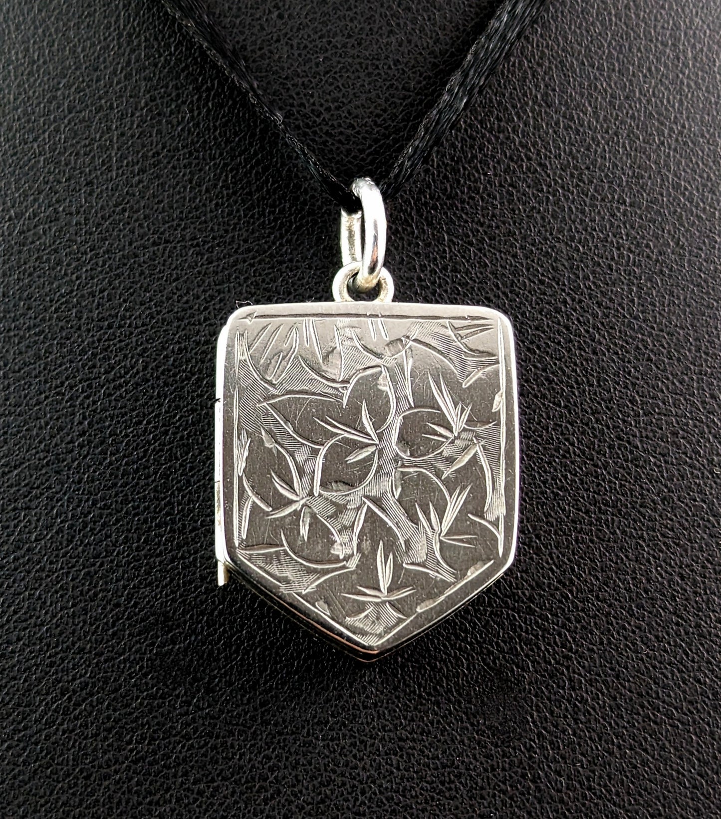 Antique silver locket pendant, Shield shaped, leaf engraved