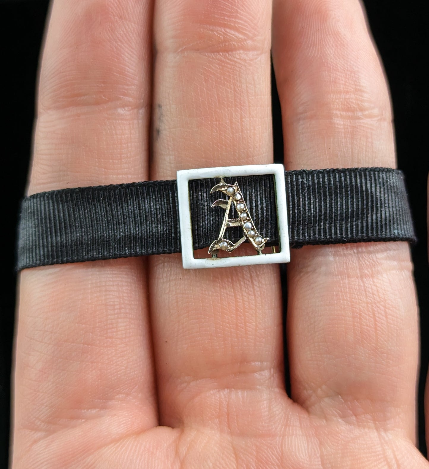 Antique A initial slider bracelet, White enamel and pearl, 9ct gold, black silk