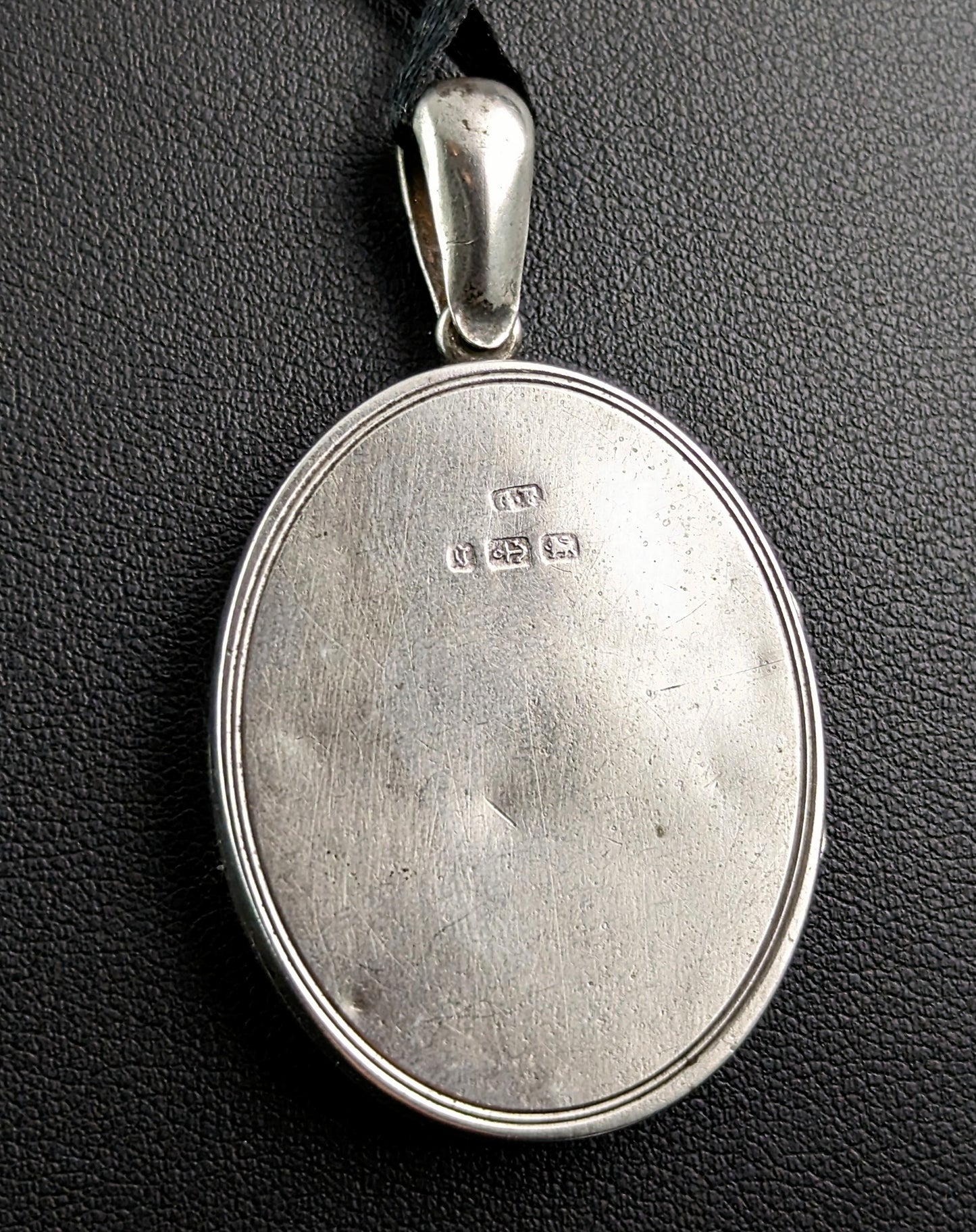 Antique Victorian sterling silver locket, leaf engraved
