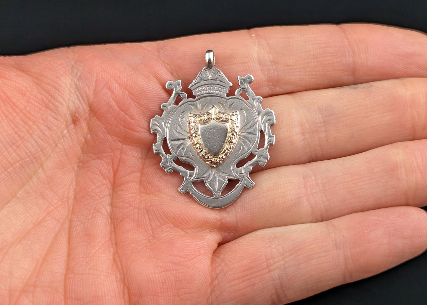 Antique silver and gold shield shaped fob pendant