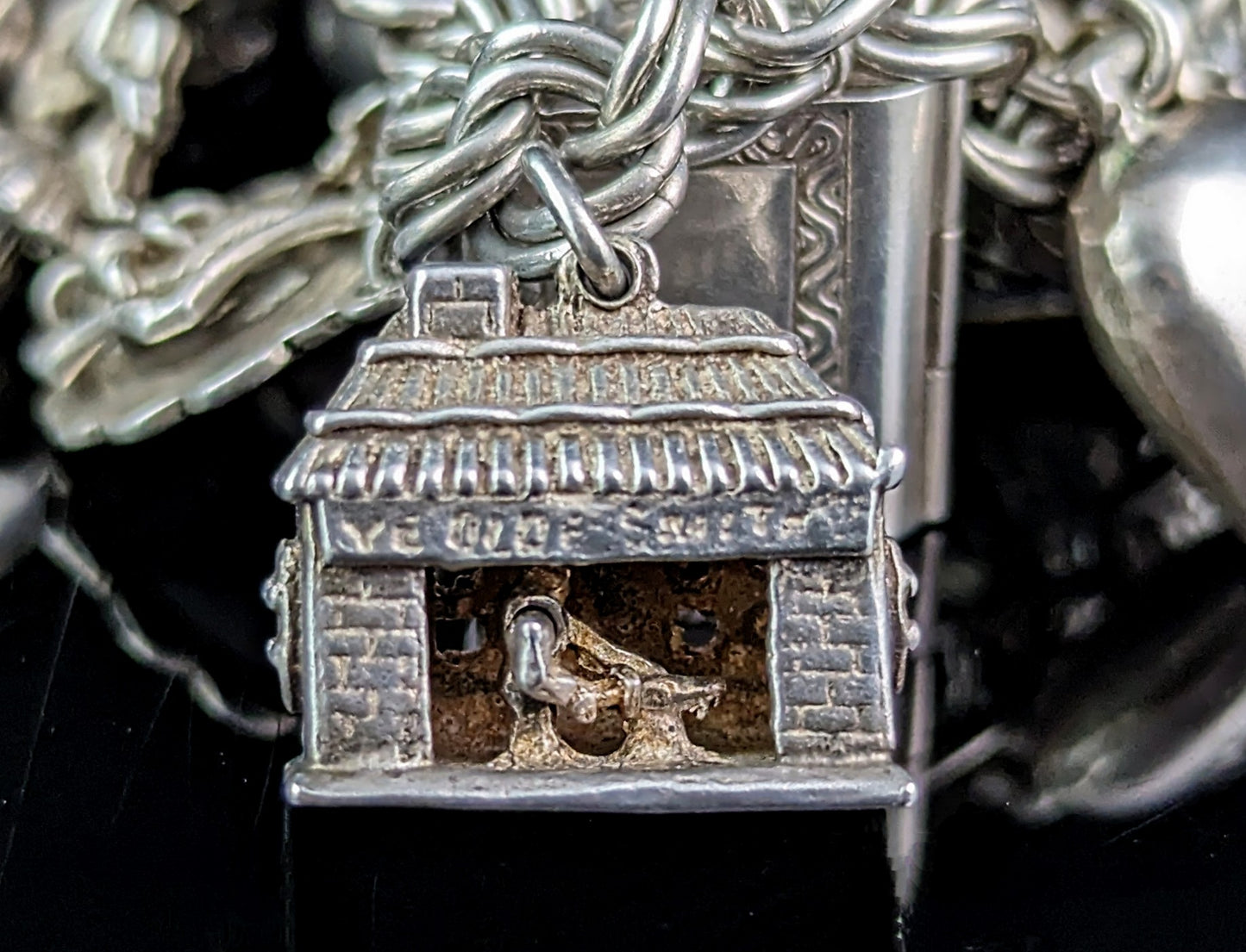Vintage sterling silver loaded charm bracelet, heavy