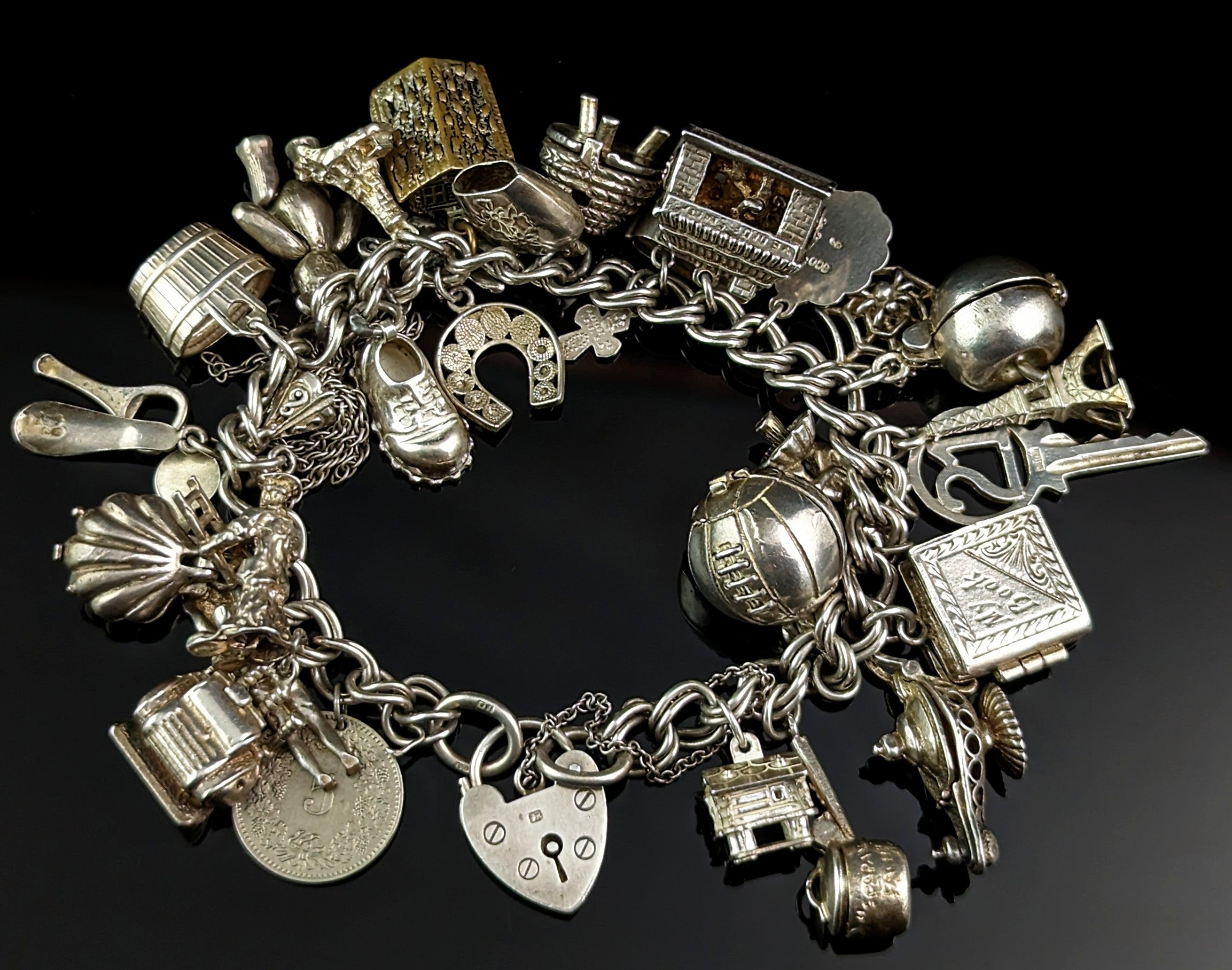 Heavy silver charm bracelet hotsell