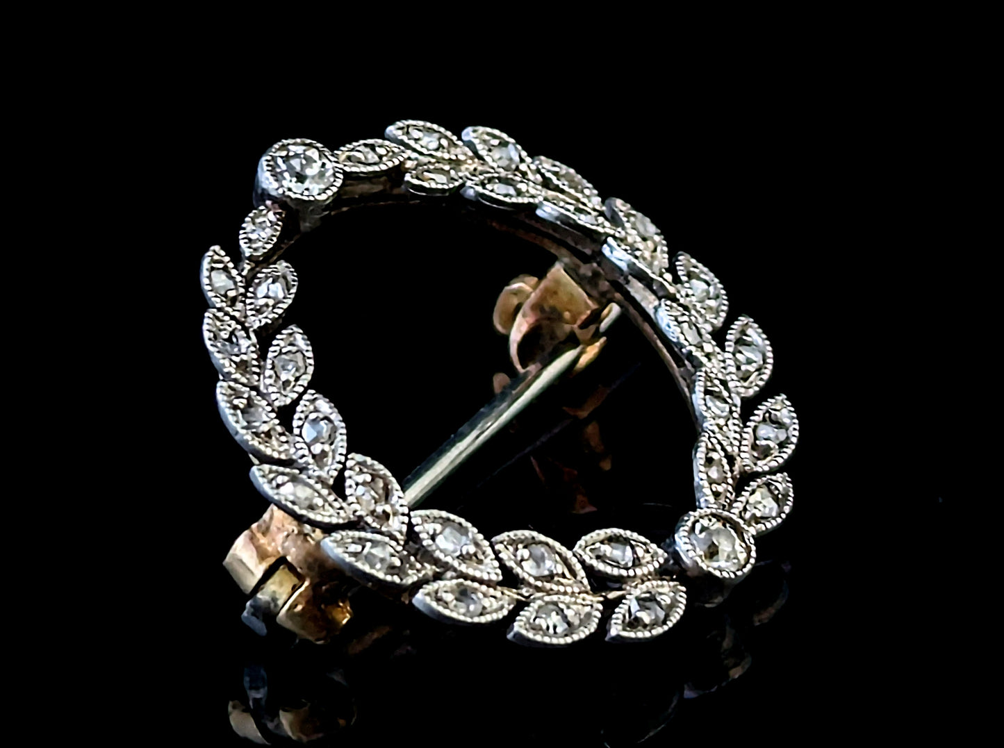 Antique diamond wreath brooch, 9ct gold and platinum