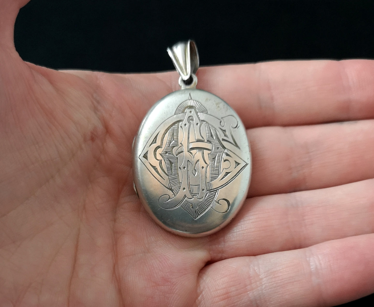 Victorian silver mourning locket, heraldic monogram