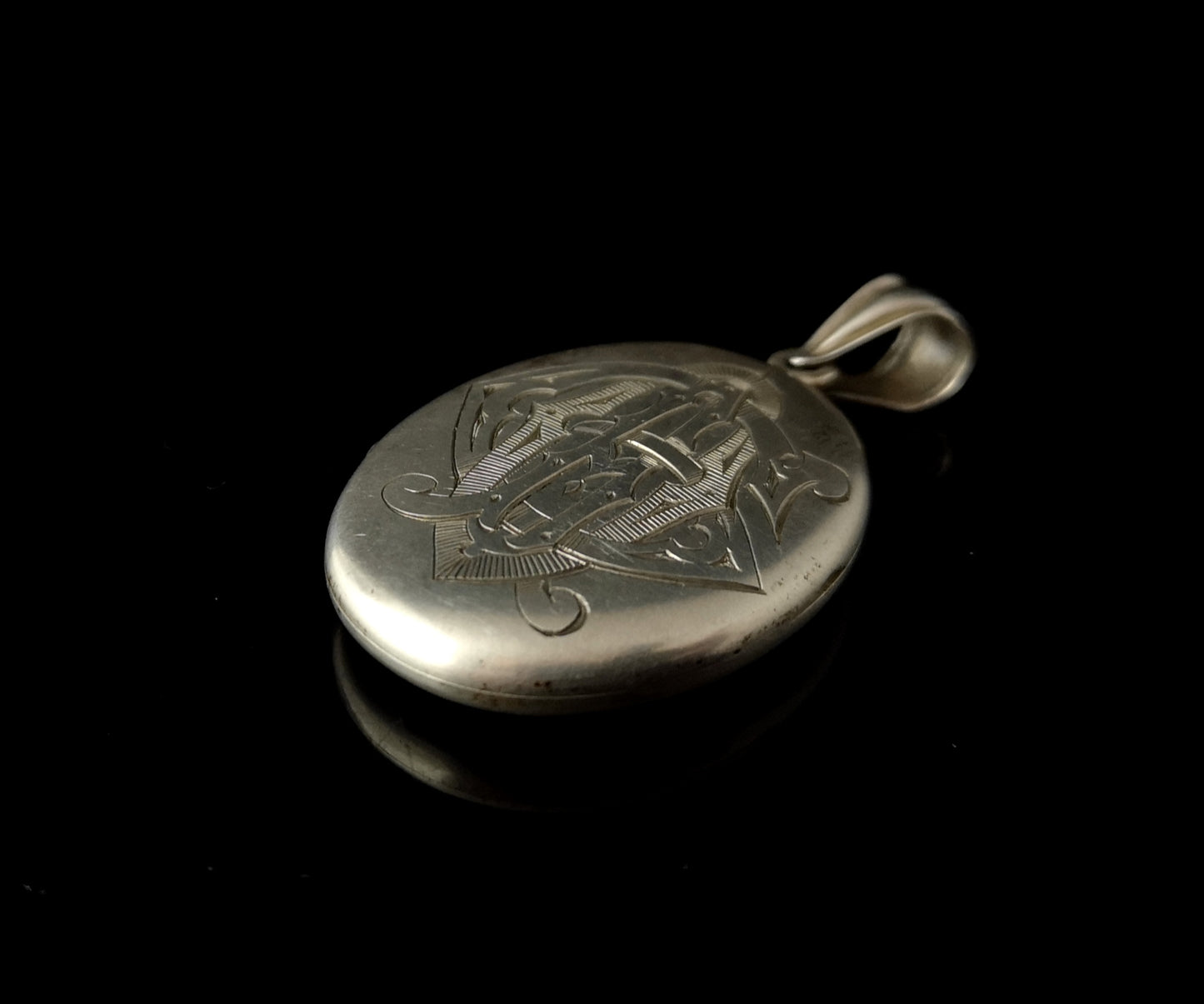 Victorian silver mourning locket, heraldic monogram