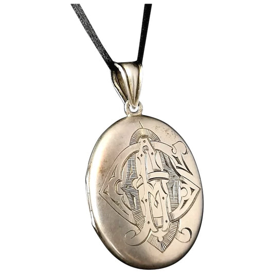 Victorian silver mourning locket, heraldic monogram