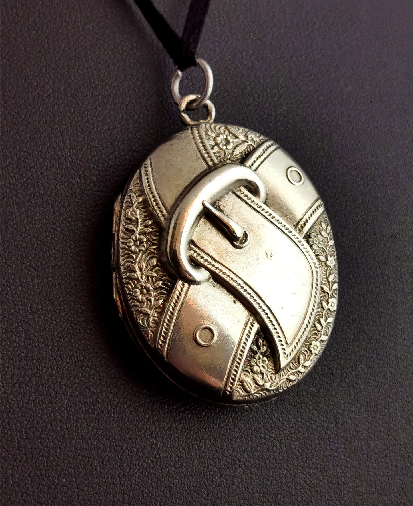 Victorian silver locket, buckle and flowers
