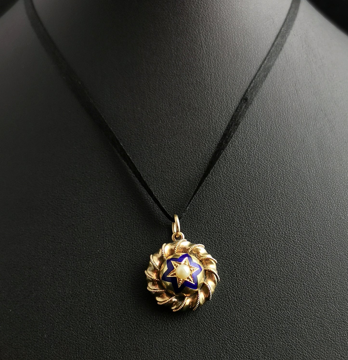 Victorian gold, blue enamel and split pearl star locket, pendant