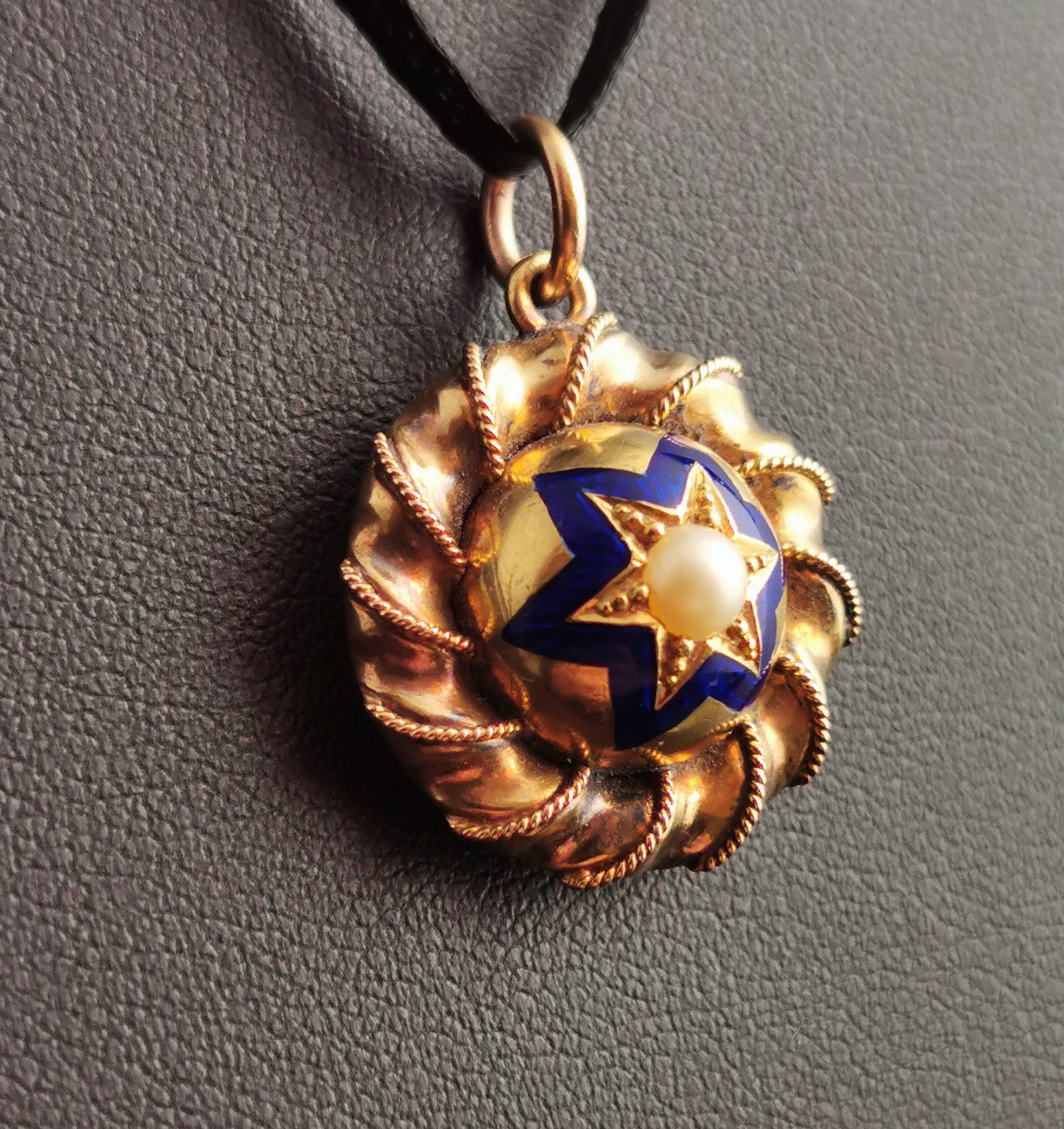 Victorian gold, blue enamel and split pearl star locket, pendant