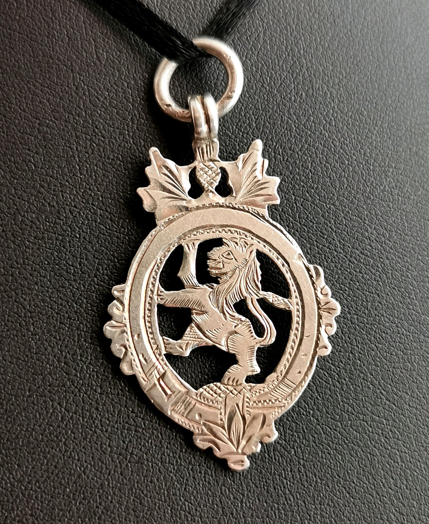 Vintage sterling silver fob pendant, Lion, Thistle and buckle