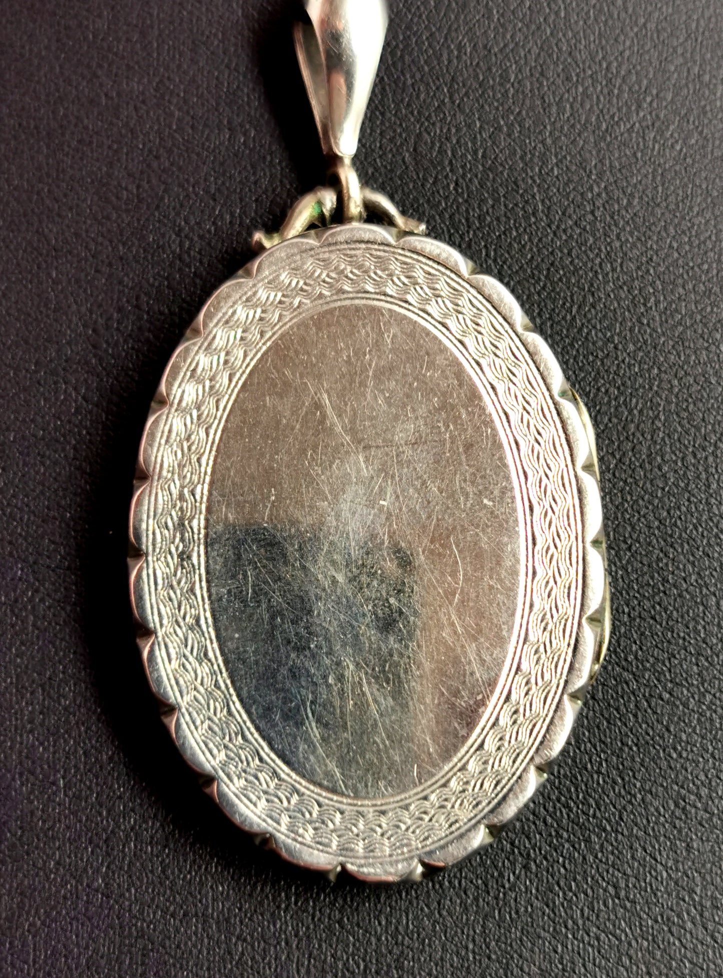 Victorian silver locket pendant, leaf engraved
