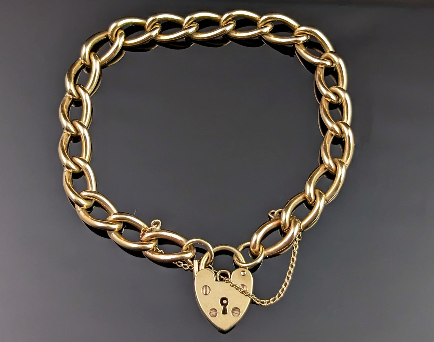 Vintage 9ct gold curb link bracelet, heart padlock clasp