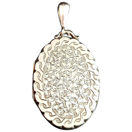 Victorian silver locket pendant, leaf engraved
