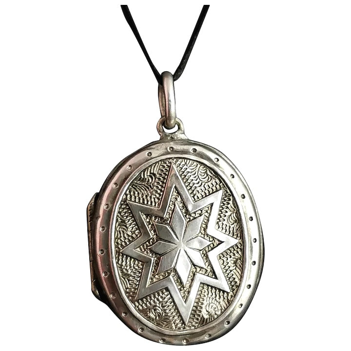 Victorian silver star locket, floral engraved