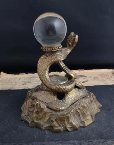 Antique bronze snake inkwell, crystal ball, compass